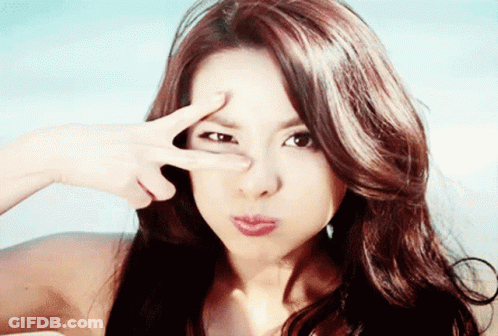 Woman Making Peace Sign GIF