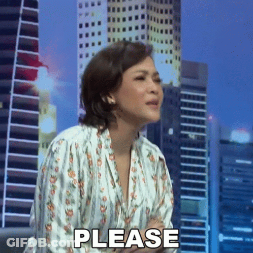 Woman Making Please Gesture In Front Of City Skyline GIF