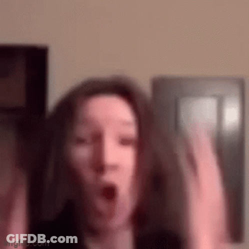 Woman Making Surprised Face With Hands Up GIF