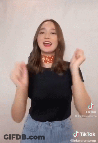 Woman Making TikTok Black Shirt Blue Jeans GIF