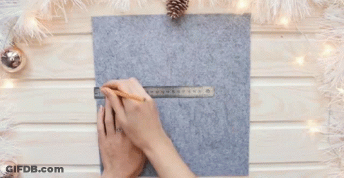 Woman Measuring Felt With Ruler And Pencil GIF