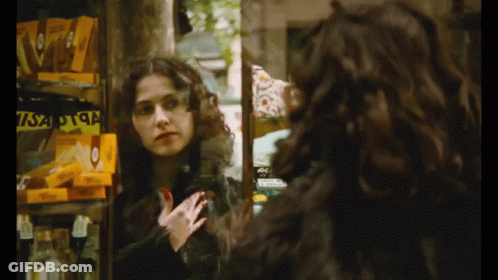 Woman Mirror Reflection With Yellow Visa Box GIF