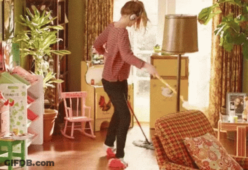 Woman Mopping Living Room Floor Listening To Music GIF