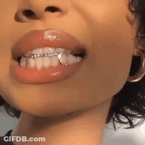 Woman Mouth With Grills And Earrings GIF
