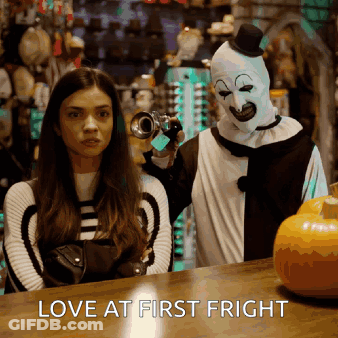 Woman Next To Clown Holding Camera Love At First Fright GIF