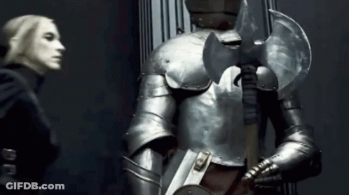 Woman Next To Man In Armor GIF