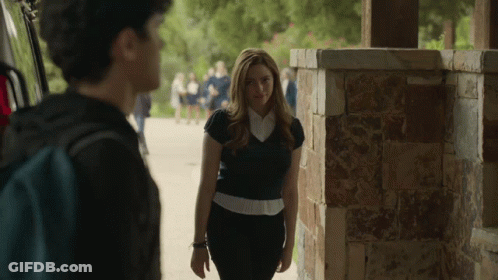 Woman Next To Man With Backpack GIF