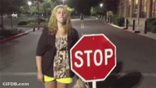 Woman Next To Stop Sign GIF
