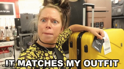 Woman Next To Yellow Suitcase Saying It Matches My Outfit GIF