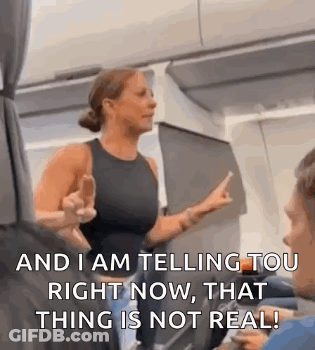 Woman On Airplane Giving Middle Finger Saying And I Am Telling You Right Now That Thing Is Not Real GIF