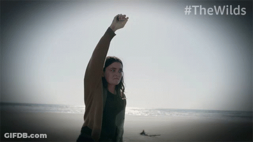 Woman On Beach With Fist In Air #Thewilds GIF