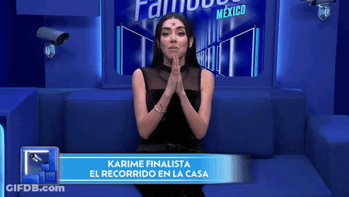 Woman On Blue Couch With Sign Karime Finalista GIF