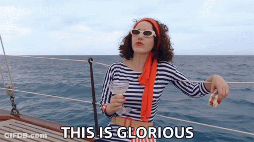 Woman On Boat Holding Wine Saying This Is Glorious GIF