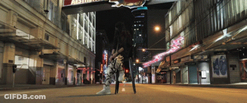 Woman On City Street Under Aesthetic Sign GIF
