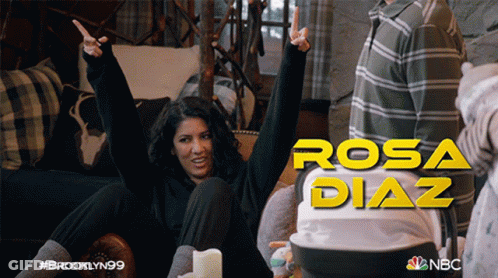 Woman On Couch Arms In Air Rosa Diaz GIF