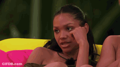 Woman On Couch Hand To Face GIF