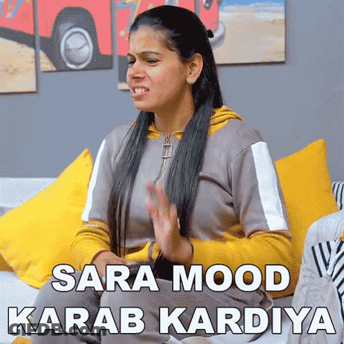 Woman On Couch Making Funny Face Sara Mood Karab Kardiya GIF