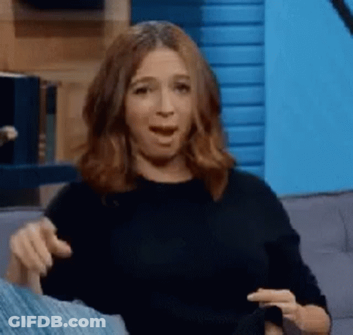 Woman On Couch Mouth Open Making Face GIF