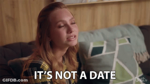 Woman On Couch Saying It's Not A Date GIF