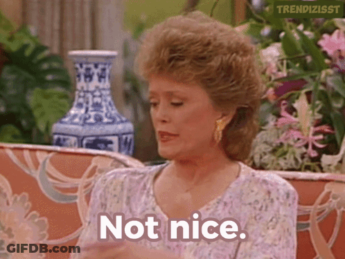 Woman On Couch Saying Not Nice GIF
