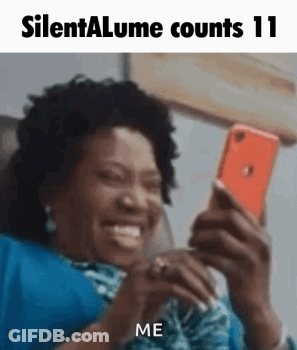 Woman On Couch Smiling At Phone GIF