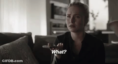 Woman On Couch Talking On Cell Phone Saying What GIF