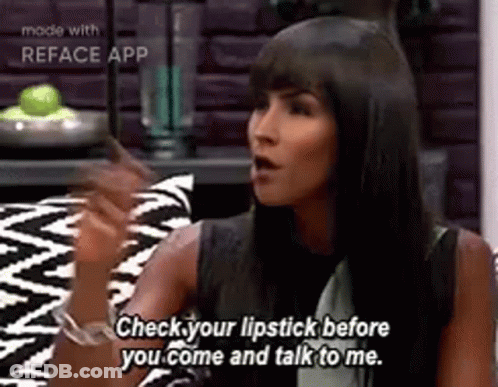 Woman On Couch Talking Wearing Lipstick GIF