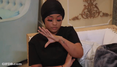 Woman On Couch With Zeusa Tattoo GIF