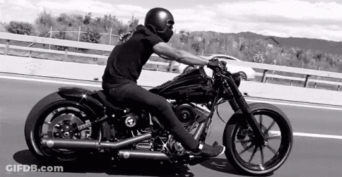 Woman On Motorcycle Next To Standing Woman GIF