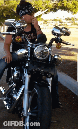 Woman On Motorcycle Wearing Biker Shirt GIF