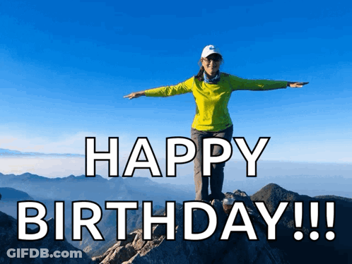 Woman On Mountain Arms Outstretched Saying Happy Birthday GIF