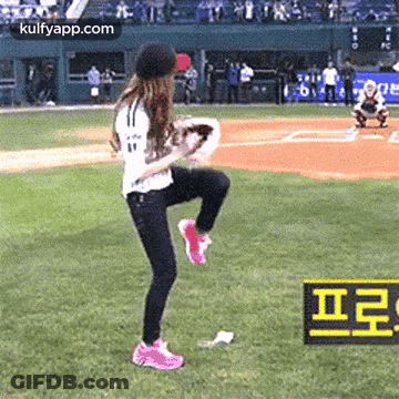 Woman On One Leg With Baseball Glove On Field GIF