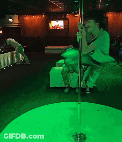 Woman On Pole In Green Room GIF