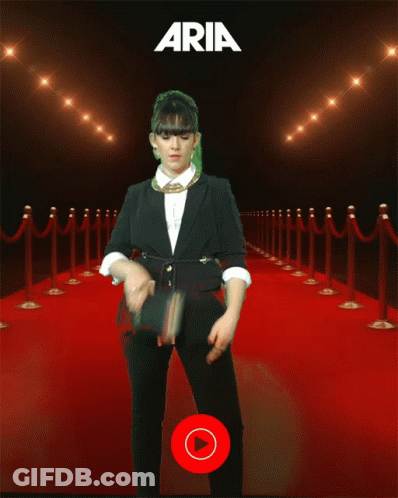 Woman On Red Carpet In Front Of YouTube Music Sign GIF