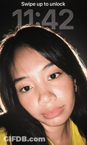 Woman On Screen Saying Swipe Up To Unlock 11:42 GIF
