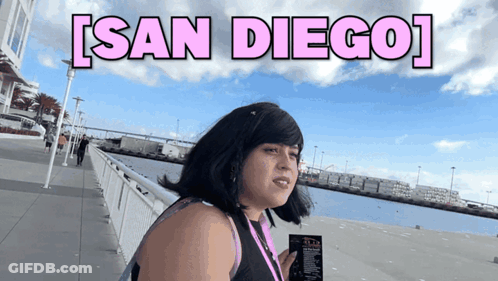 Woman On Sidewalk With San Diego Above GIF