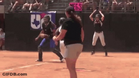 Woman On Softball Field With Catcher And Umpire GIF