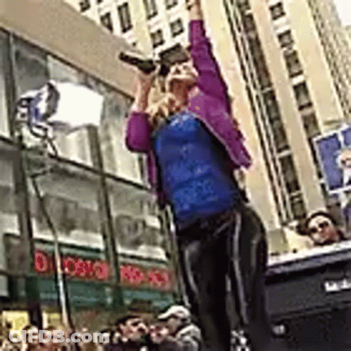 Woman On Stage Holding Beer GIF