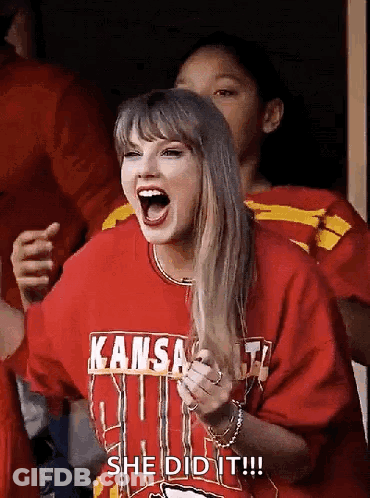 Woman On Stage In Front Of Screen GIF