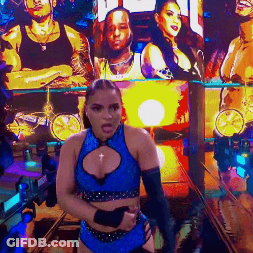 Woman On Stage With Jaida Parkes On Screen GIF