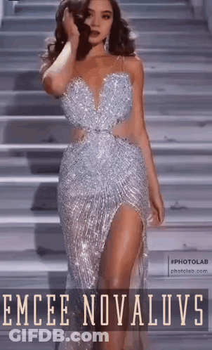 Woman On Stairs In Silver Dress GIF