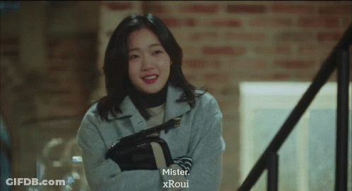 Woman On Stairs With Mister Xroui Above GIF