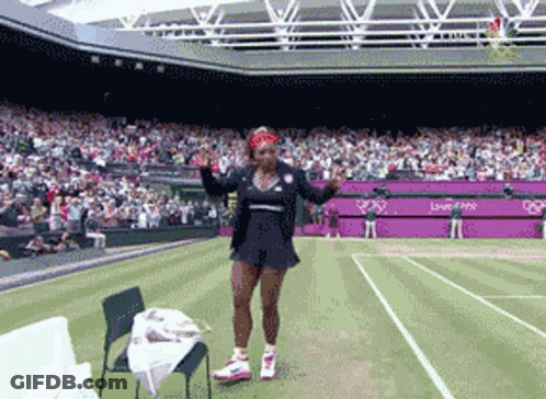 Woman On Tennis Court In Front Of London 2012 Stadium GIF