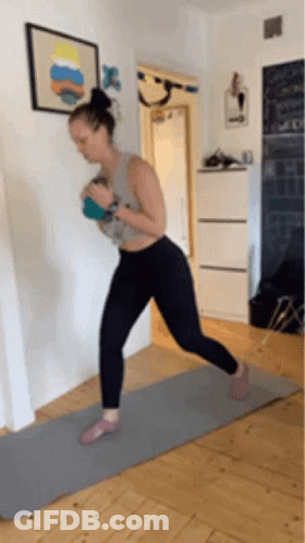 Woman On Yoga Mat Holding Ball GIF