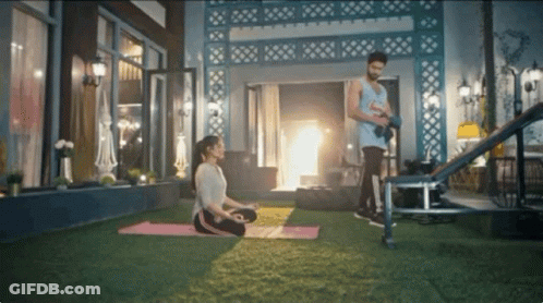 Woman On Yoga Mat Man With Dumbbells GIF