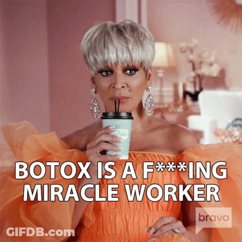 Woman Orange Dress Holding Coffee Botox F***ing Miracle Worker GIF