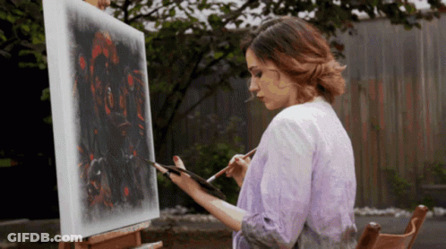 Woman Painting On Canvas On Easel GIF