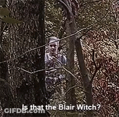 Woman Peeking Behind Tree Blair Witch GIF