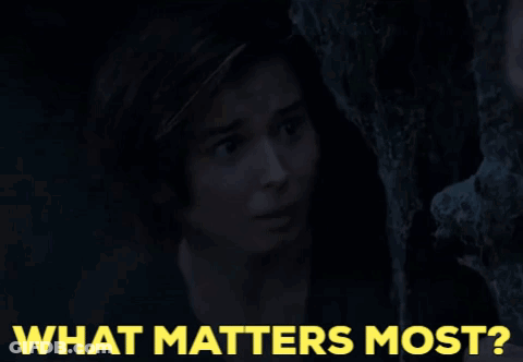 Woman Peeking From Behind Tree What Matters Most GIF