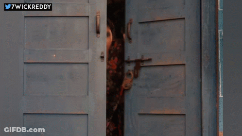 Woman Peeking Out Door 7Wickreddy GIF